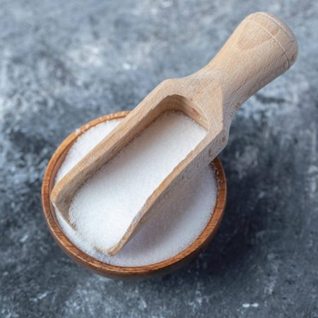 salt-in-wooden-spoon-on-marble-background-min